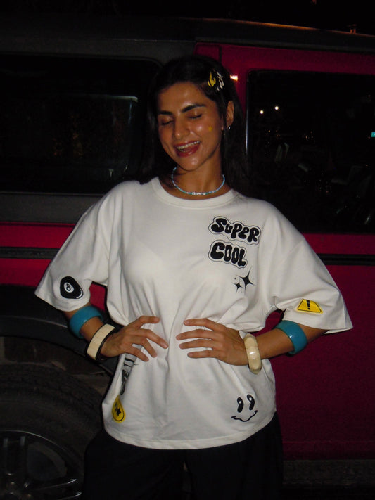 Model wearing statement graphic tee styled for a trendy street style outfit
