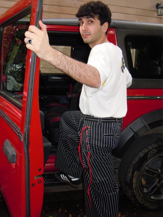 Man in ikami t-shirt and ikami street tailored trousers styled for a day out