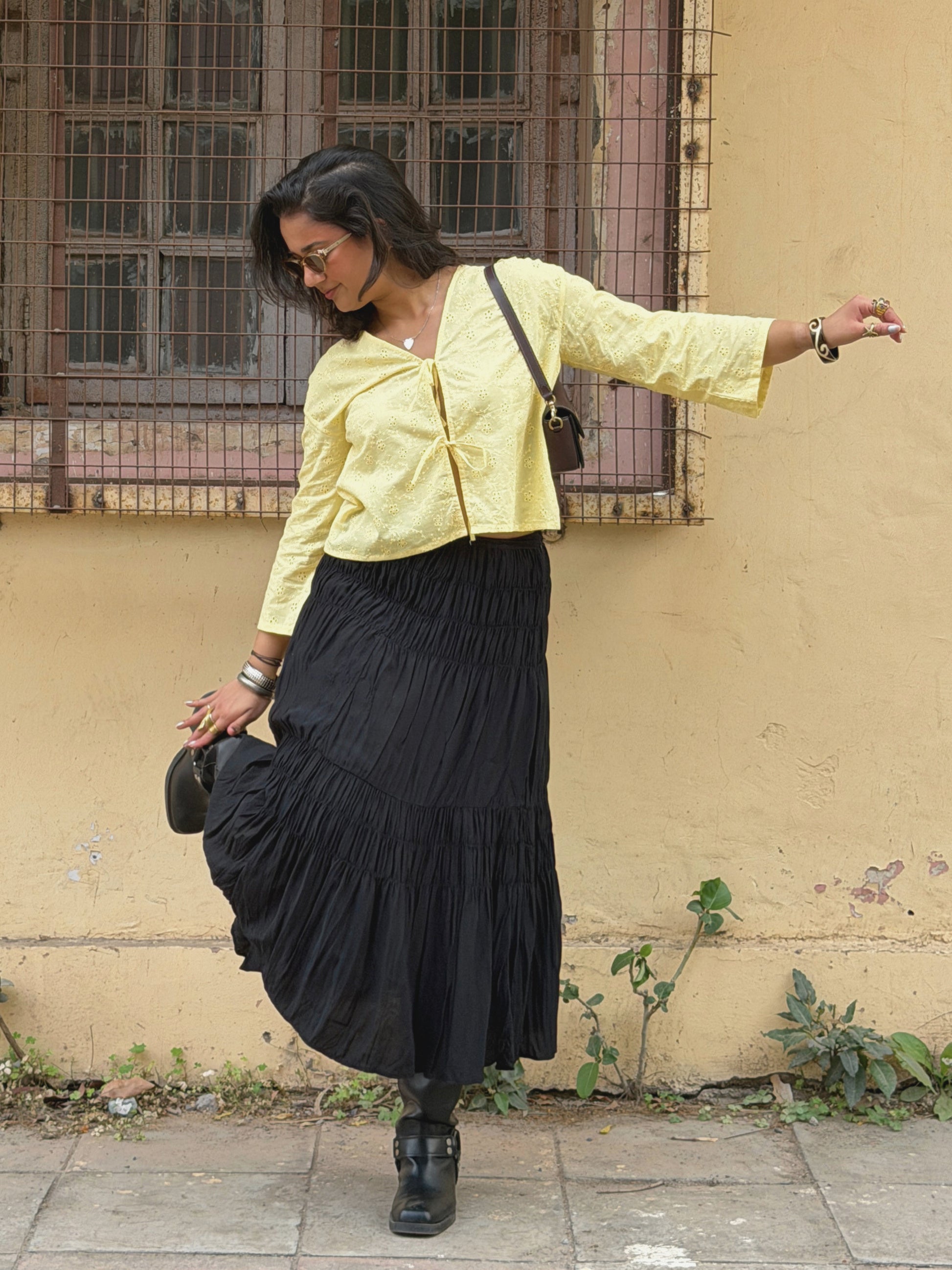 Model wearing yellow Ikami Copenhagen top outdoors