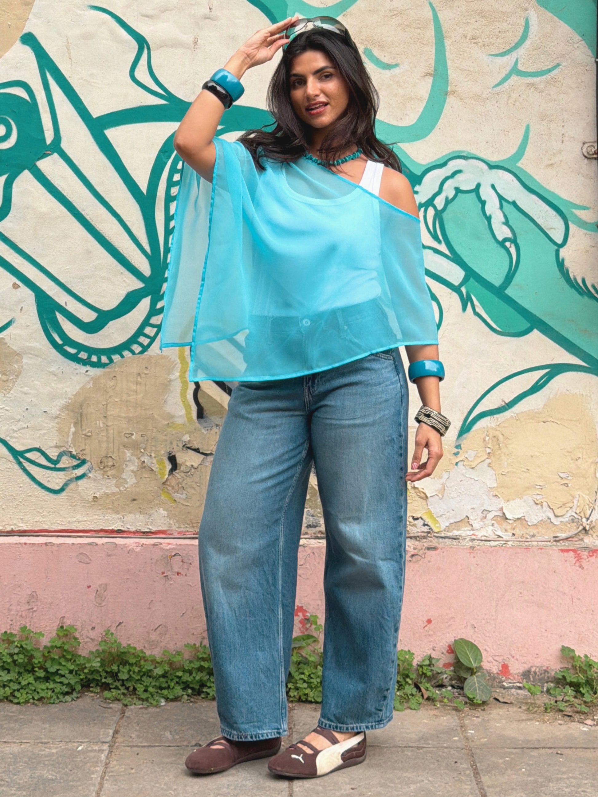 Flowy blue sheer poncho for beach and resort wear styling