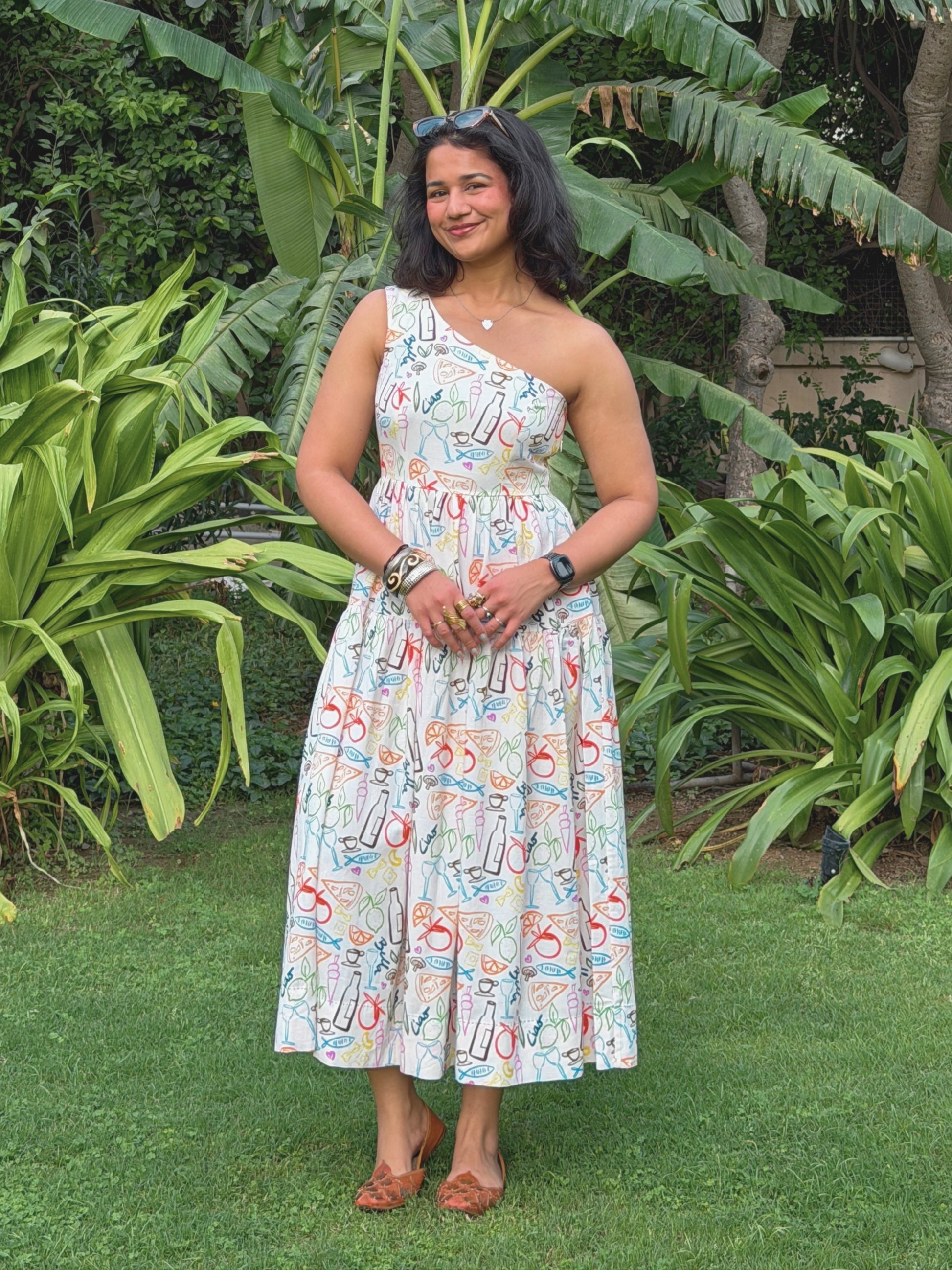 model in statement linen dress with custom mediterranean inspired print by ikami