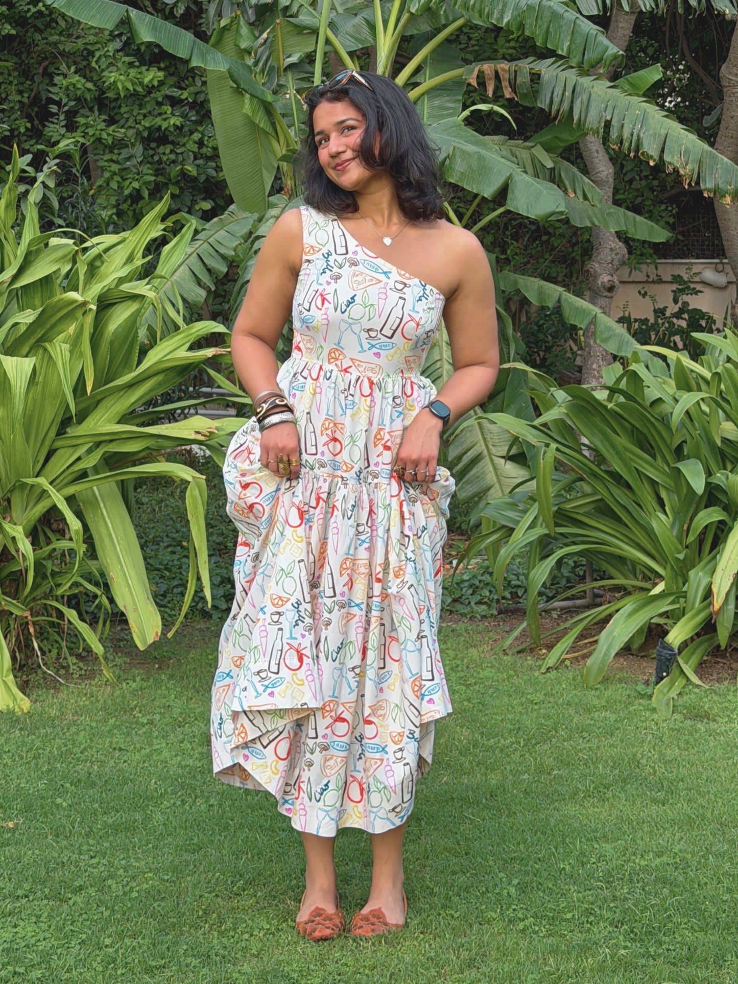 Model wearing Ikami Amalfi linen dress with custom Italy-inspired print
