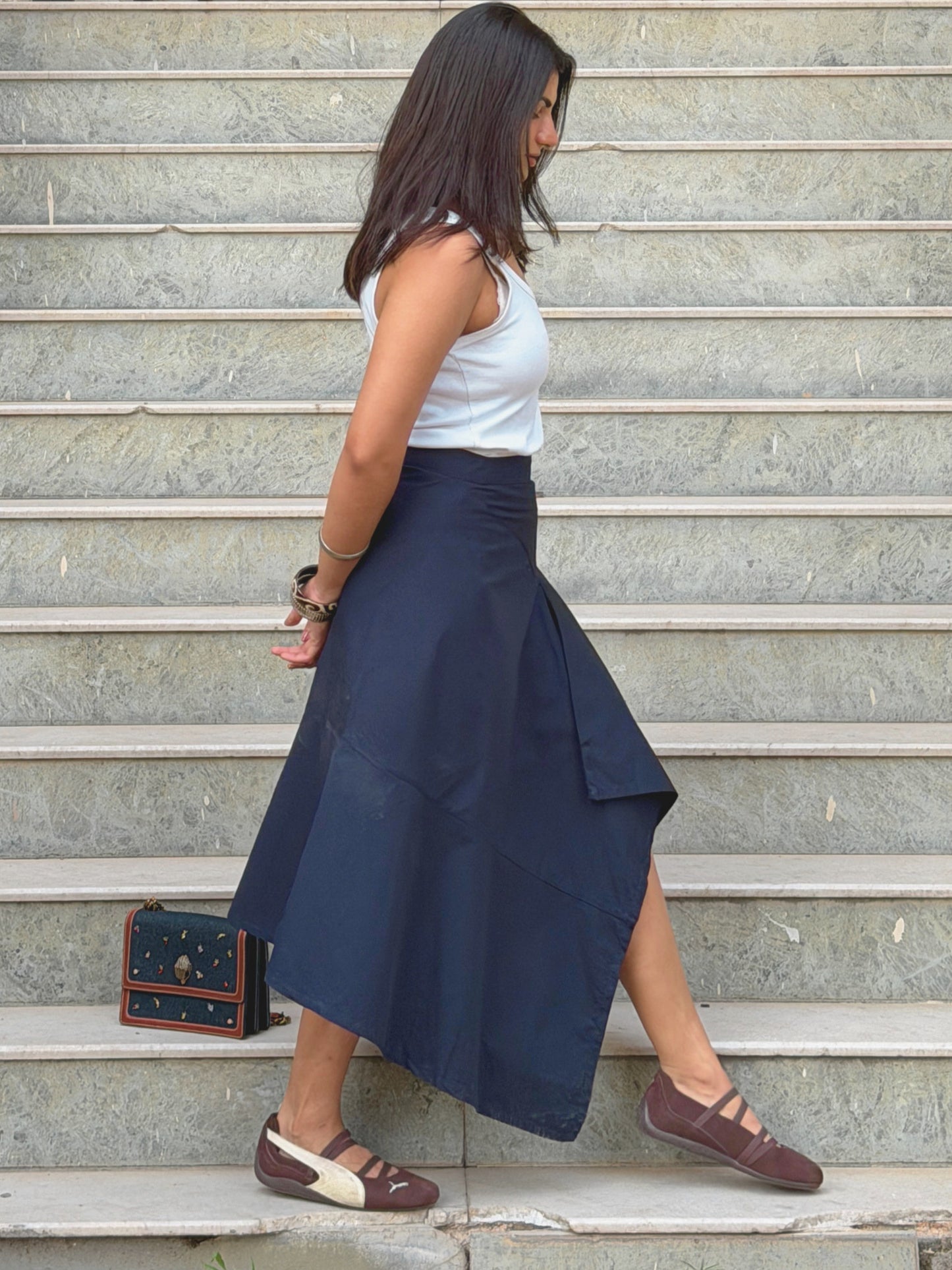 Side profile of Ikami Berlin statement skirt styled outdoors