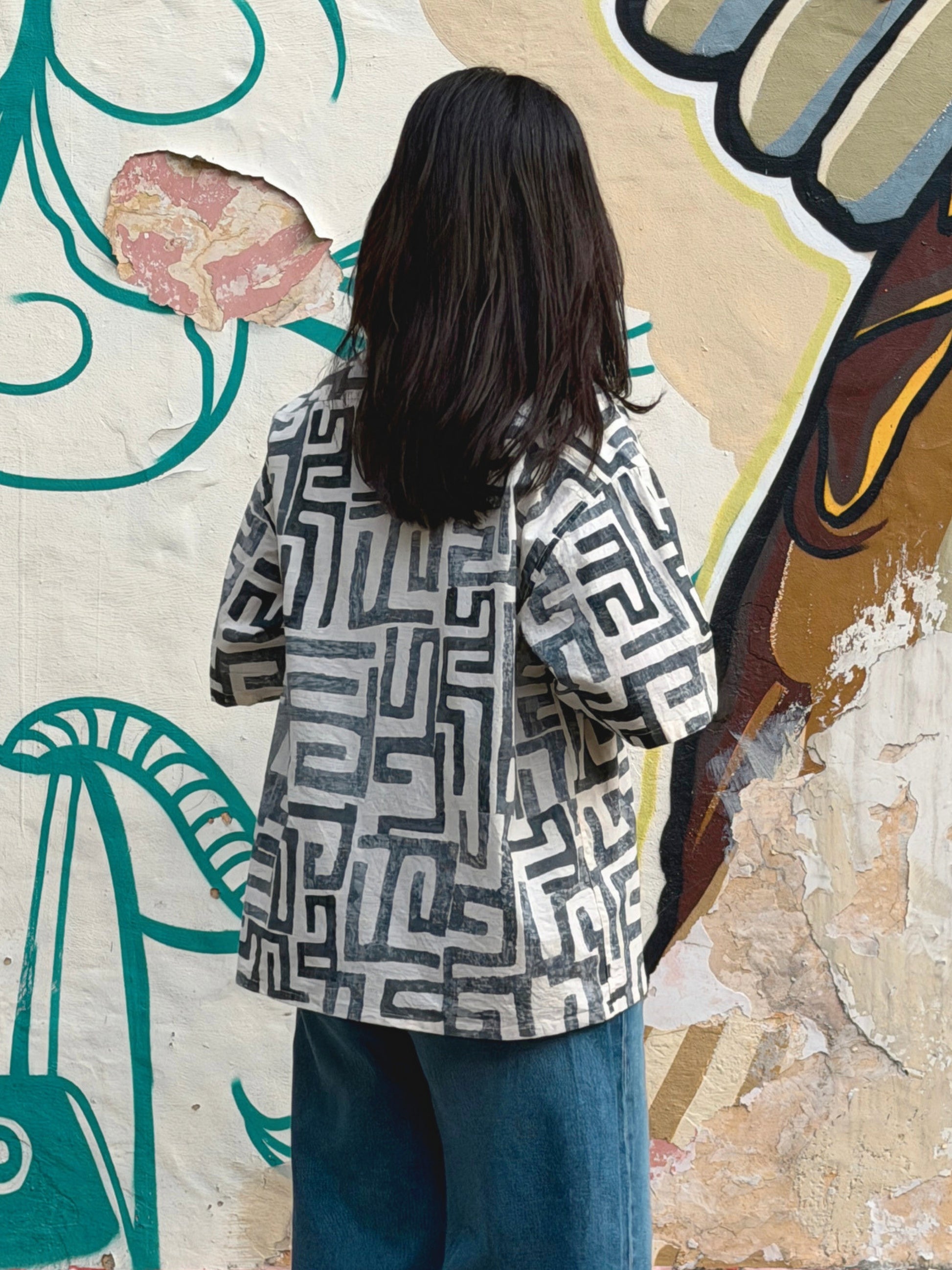 back view of model wearing the ikami madrid shirt on vacation 