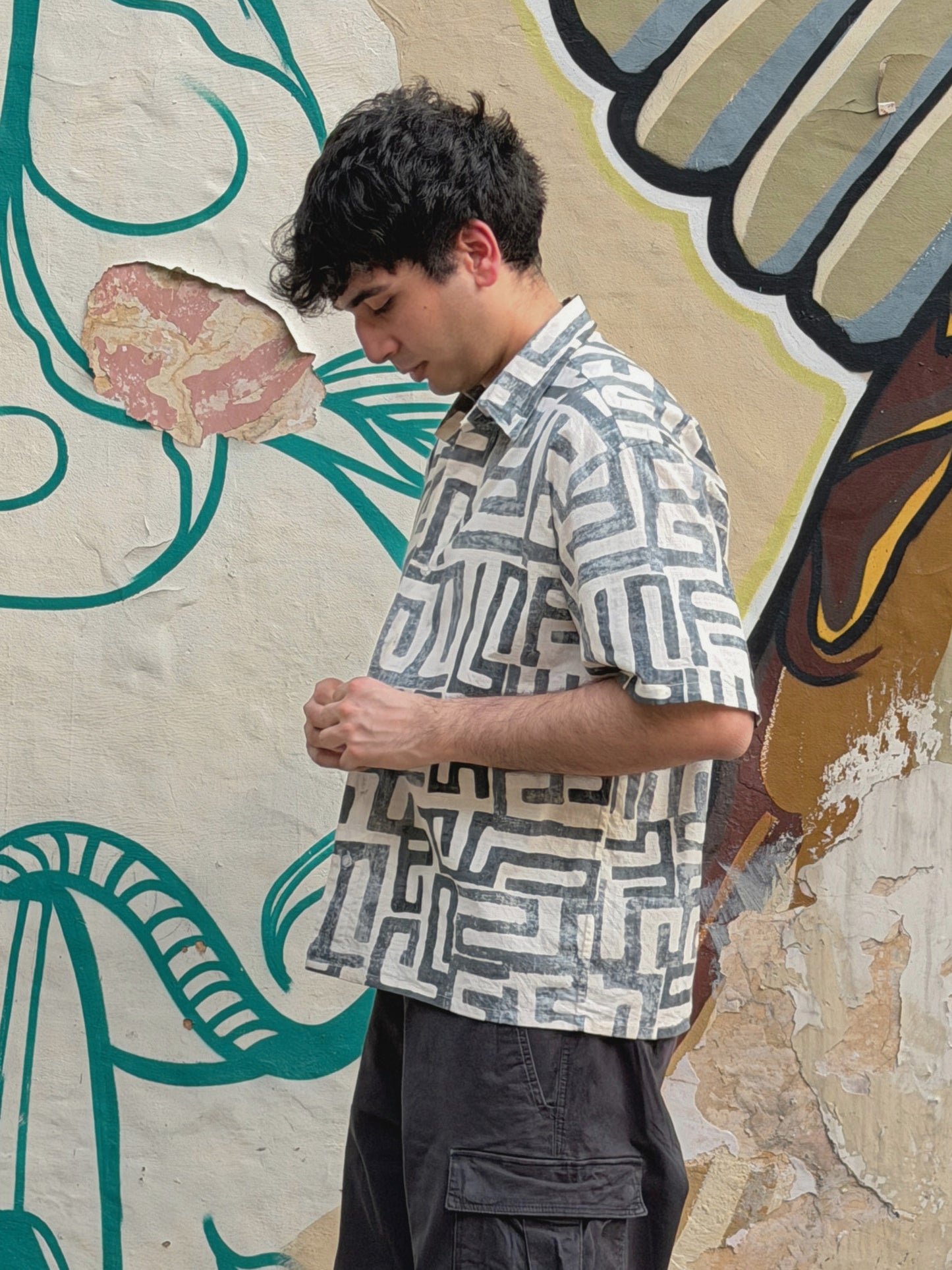 side view of model wearing the ikami madrid shirt on vacation 