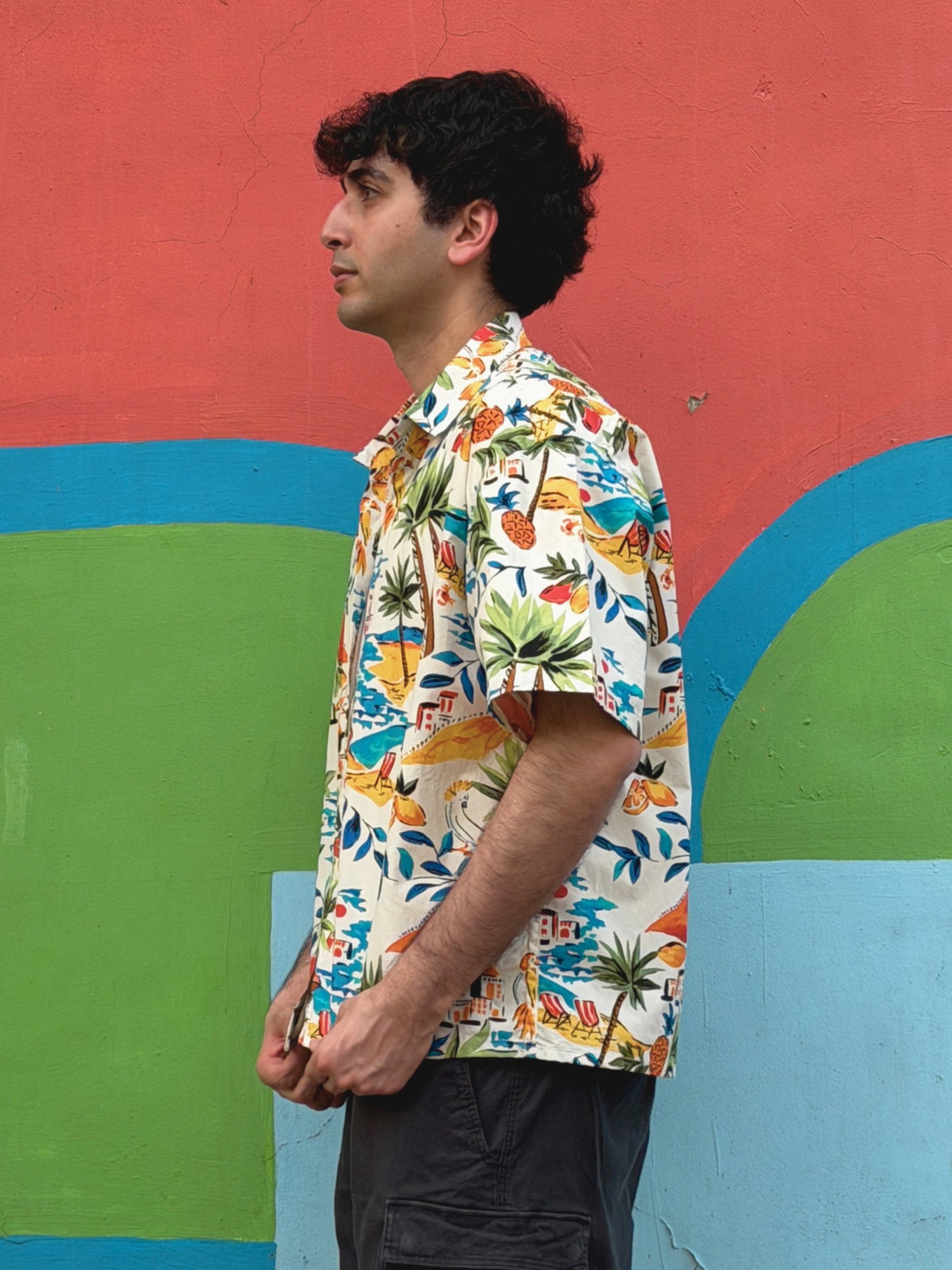 side view of model wearing the colourful ikami mykonos shirt 