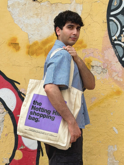 model wearing the classic ikami london shirt with the notting hill tote bag from london