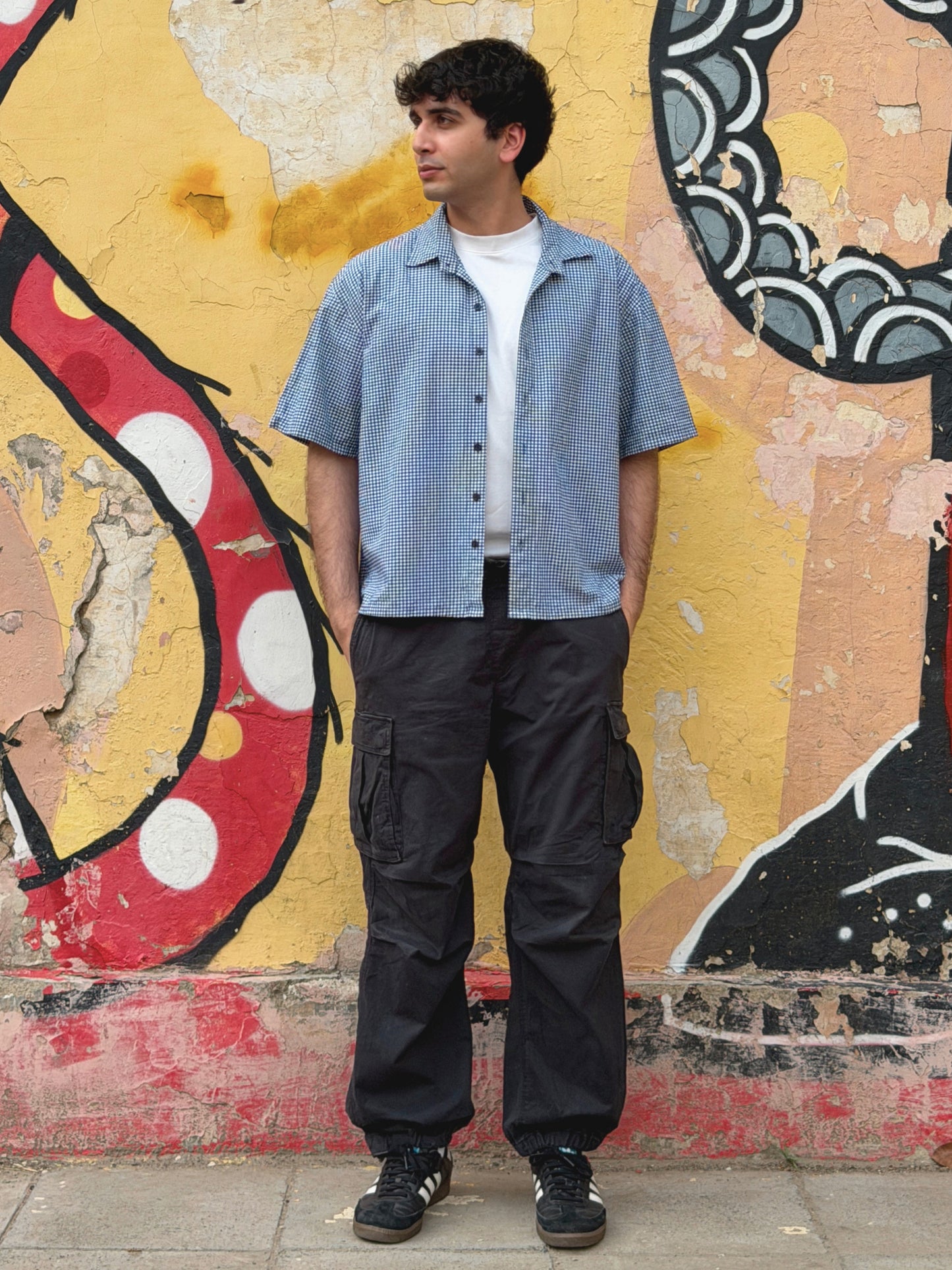 model wearing the classic ikami london shirt with a white t-shirt underneath